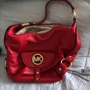 Red Michael Kors and wallet